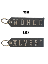 two keychains with the word world xxxss on them